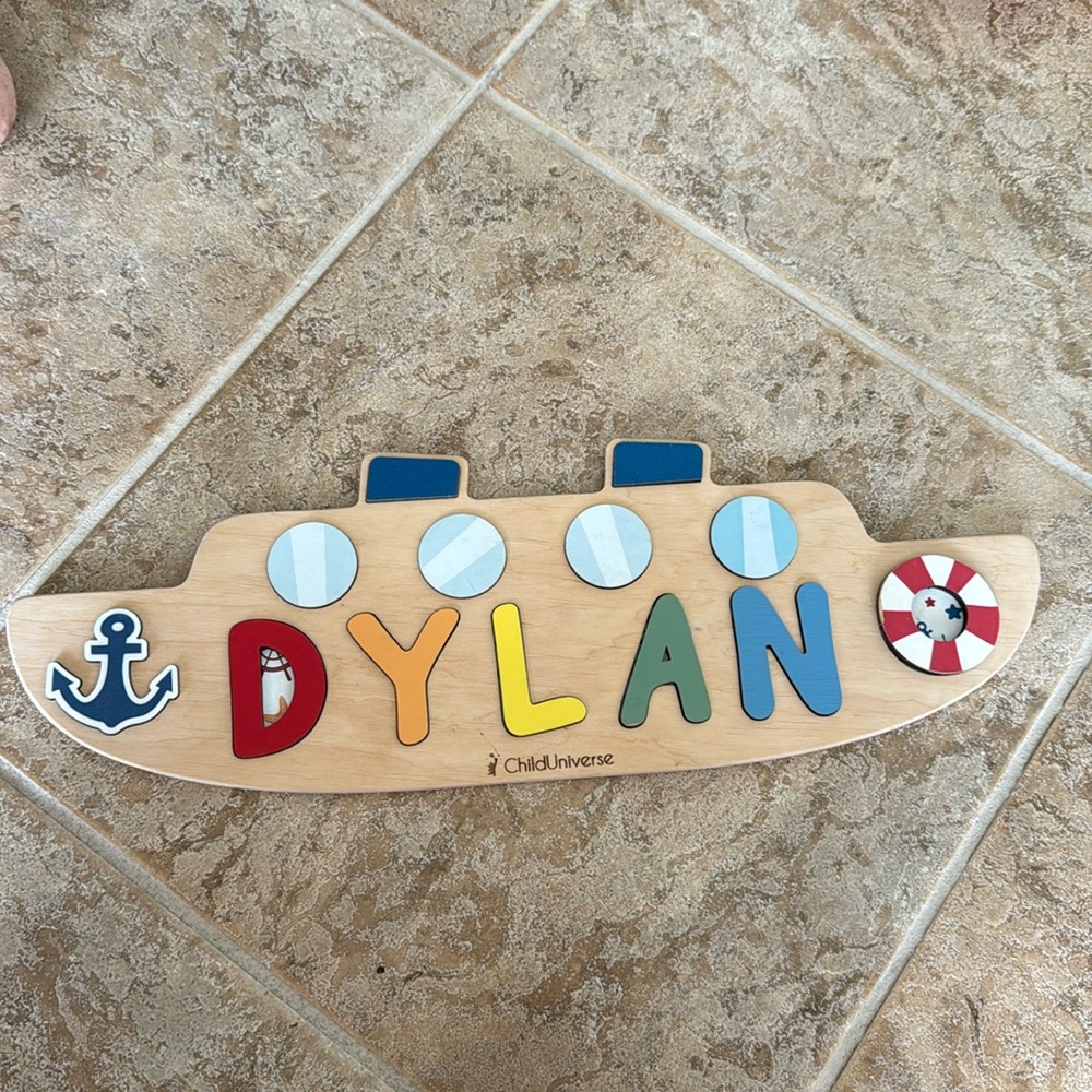 Personalized puzzle that says Dylan. Great baby gift!